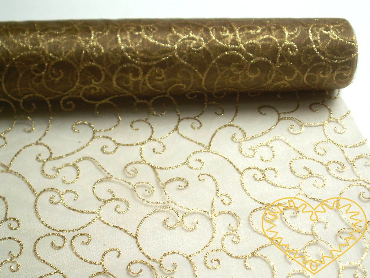 Organza zlatá se zlatým třpytivým vzorem - šíře 40 cm, délka 5 m. Vypadá velice slavnostně a reprezentativně. Vhodná k dekorování, aranžování a výzdobě slavnostní tabule, pro balení dárků, ozdob, broží apod.